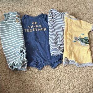 Set of Four Baby Rompers in Blue, Yellow, and Stripes
